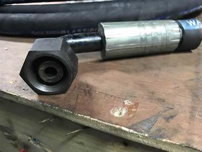 A special 90°elbow coupling on the wood board.