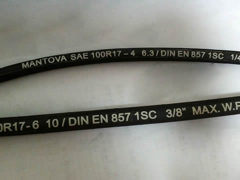 Two black color EN 857 hydraulic hose with specs on the hose surface.