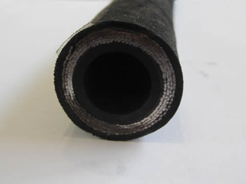 A section structure of EN 856 4SH hydraulic hose on the white background.