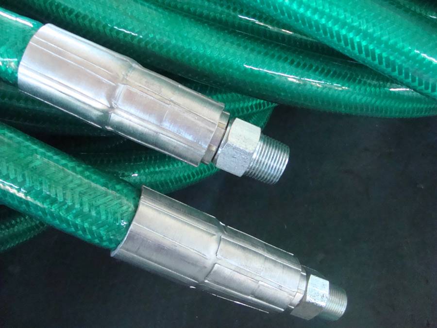 Many polymer armoured hoses are placed on the ground.